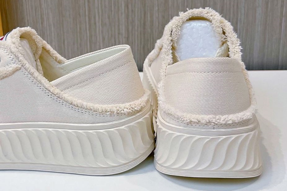 details of white canvas shoes women