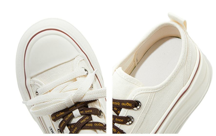 details of white canvas sneakers